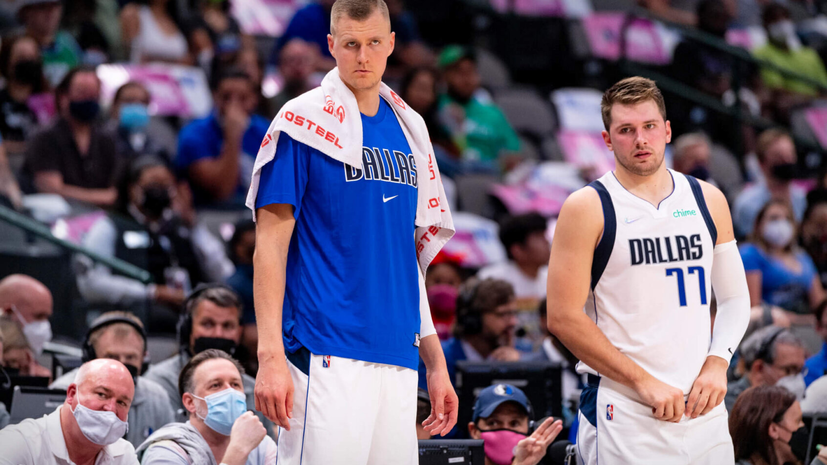 Kristaps Porzingis and Luka Doncic standing on the sidelines