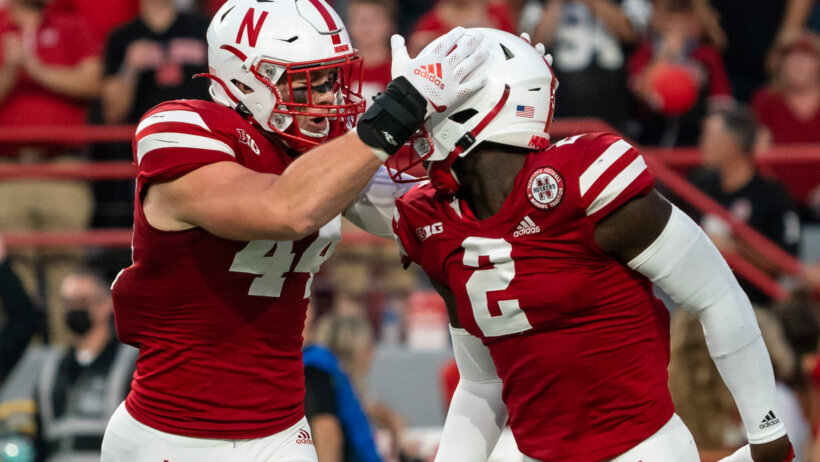 Nebraska Cornhuskers linebacker Garrett Nelson celebrates with linebacker Caleb Tannor