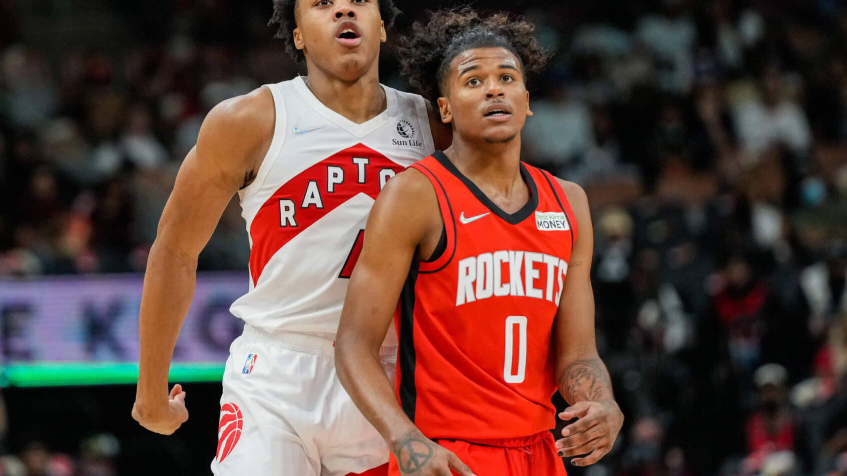 Scottie Barnes standing behind Jalen Green