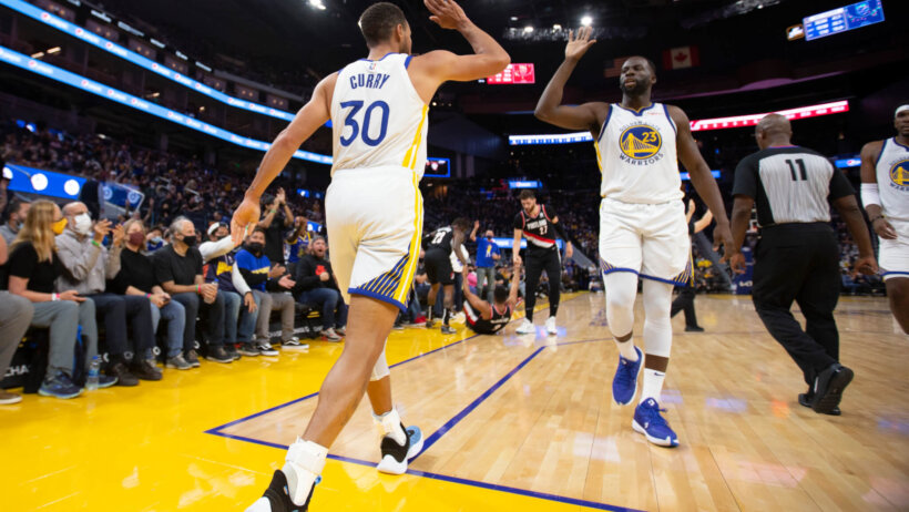 Steph Curry and Draymond dap up