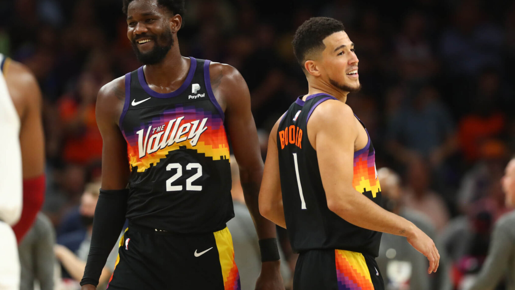 Deandre Ayton and Devin Booker share a laugh