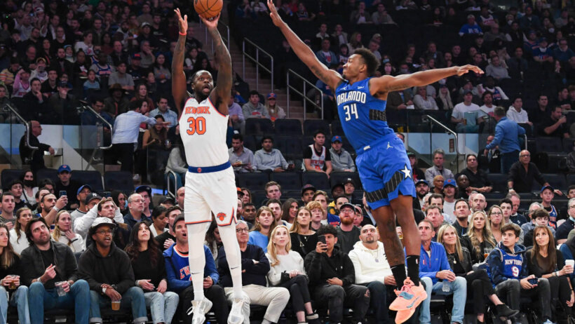 New York Knicks forward Julius Randle shooting a three against Orlando