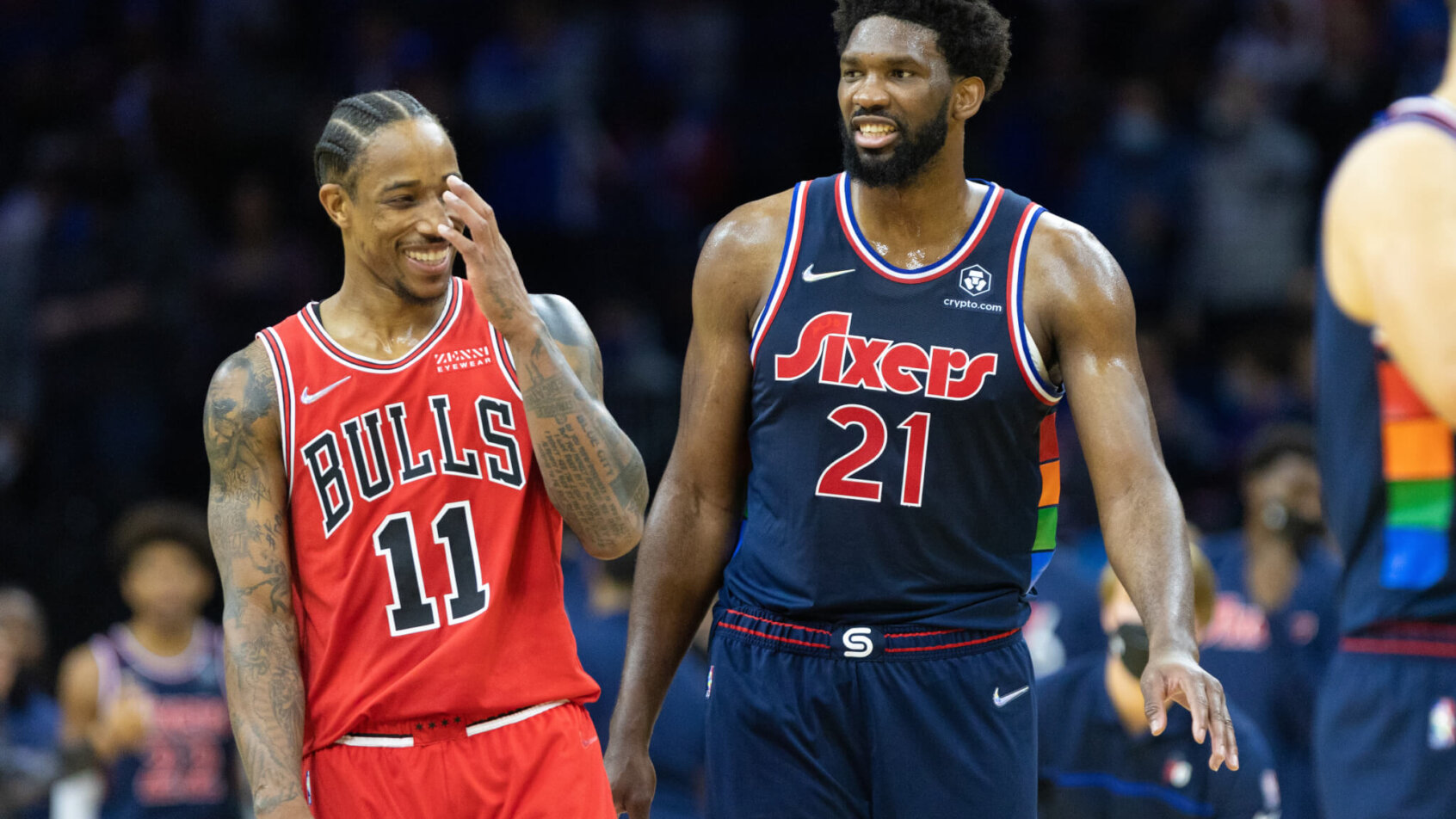 DeMar DeRozan laughing along with Joel Embiid