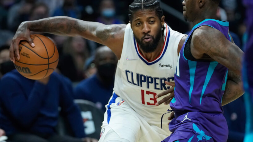 Paul George dribbling into defender
