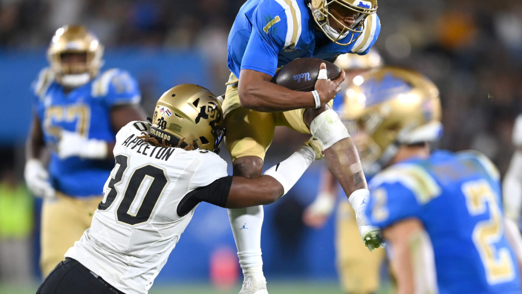 UCLA Bruins quarterback Dorian Thompson-Robinson runs the football