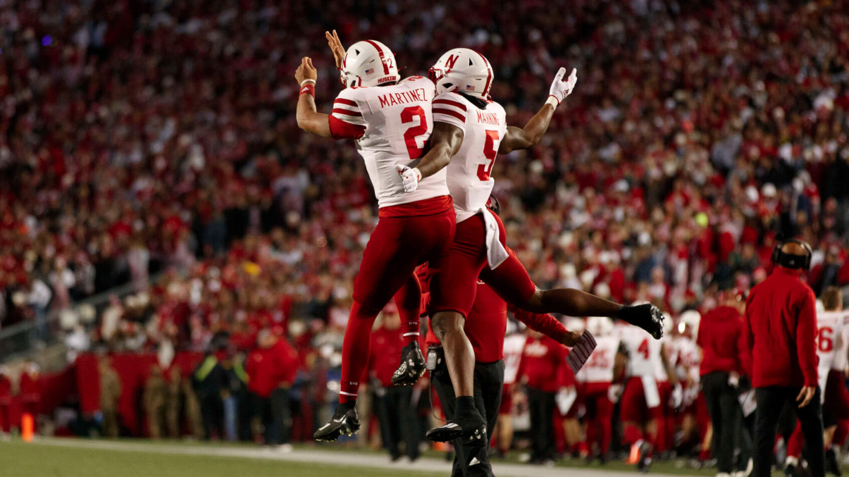 Nebraska Cornhuskers quarterback Adrian Martinez (2) celebrates with wide receiver Omar Manning after scoring a touchdown