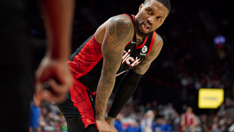 Damian Lillard hands on knees