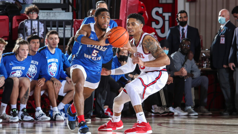 St. Francis Terriers guard Larry Moreno makes a pass