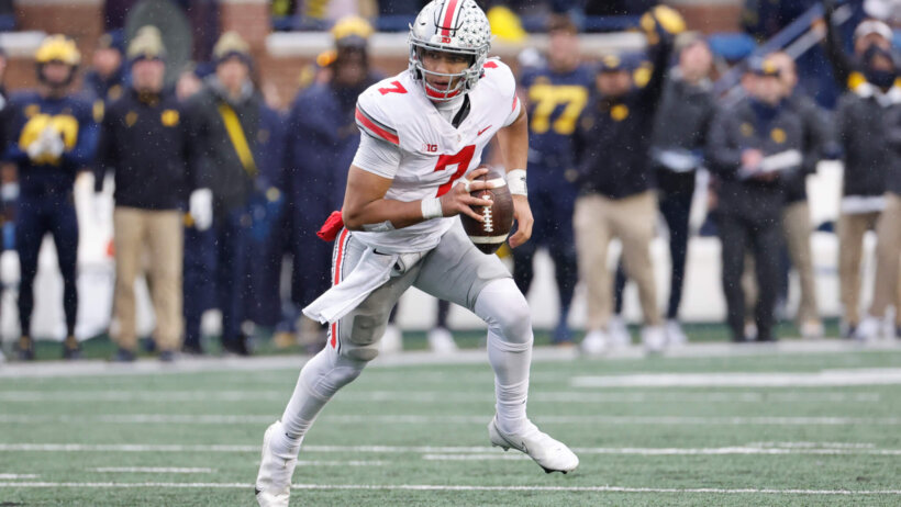 Ohio State Buckeyes quarterback C.J. Stroud rushes against the Michigan Wolverines