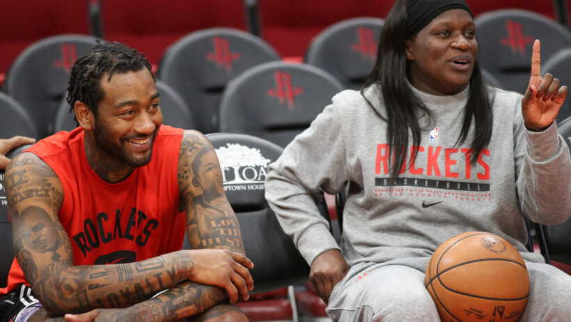 Houston guard John Wall and assistant coach Barbara Turner sitting together before a game