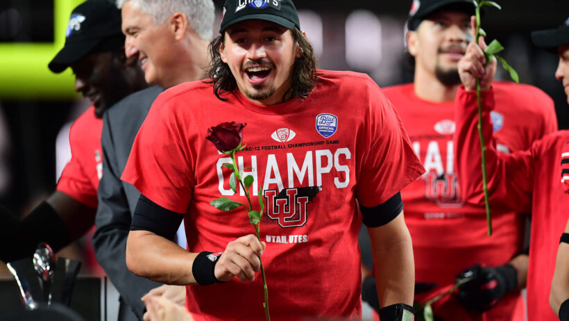 Utah Utes quarterback Cameron Rising celebrates the victory against the Oregon Ducks in the 2021 Pac-12 Championship Game