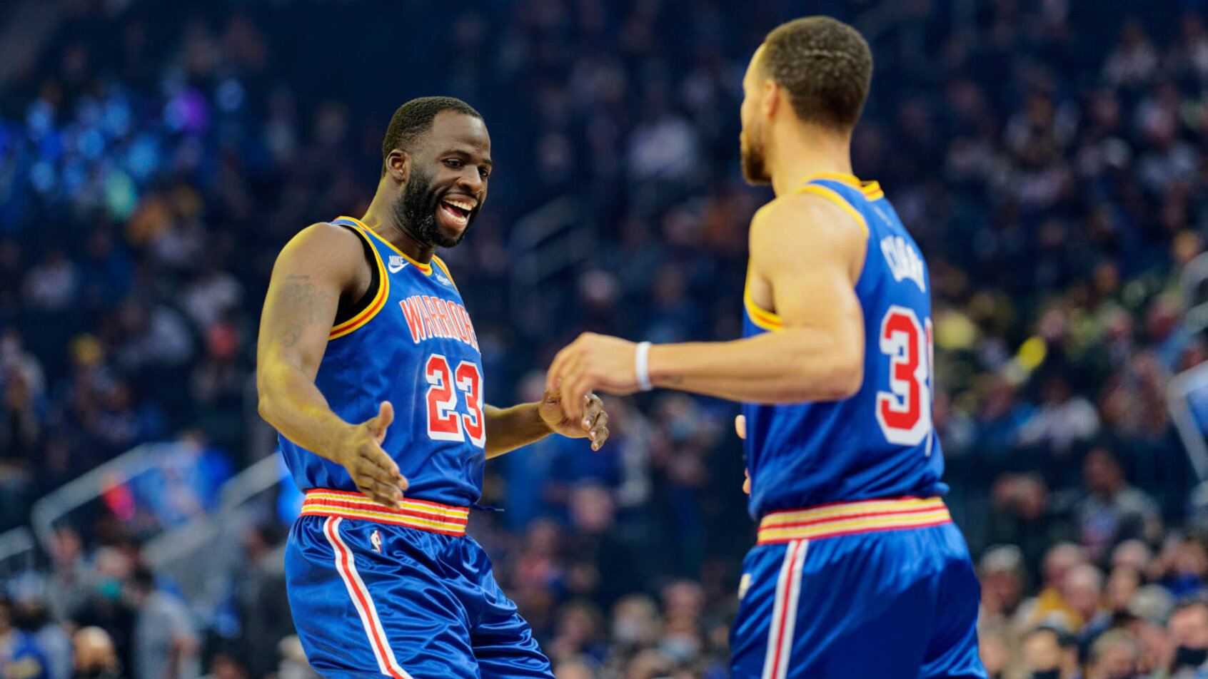 Draymond Green low-five to Steph Curry