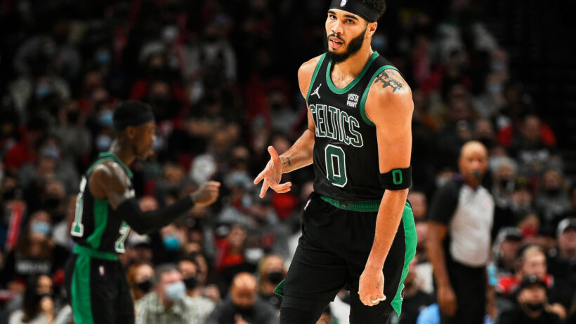 Jayson Tatum celebrates after hitting a three