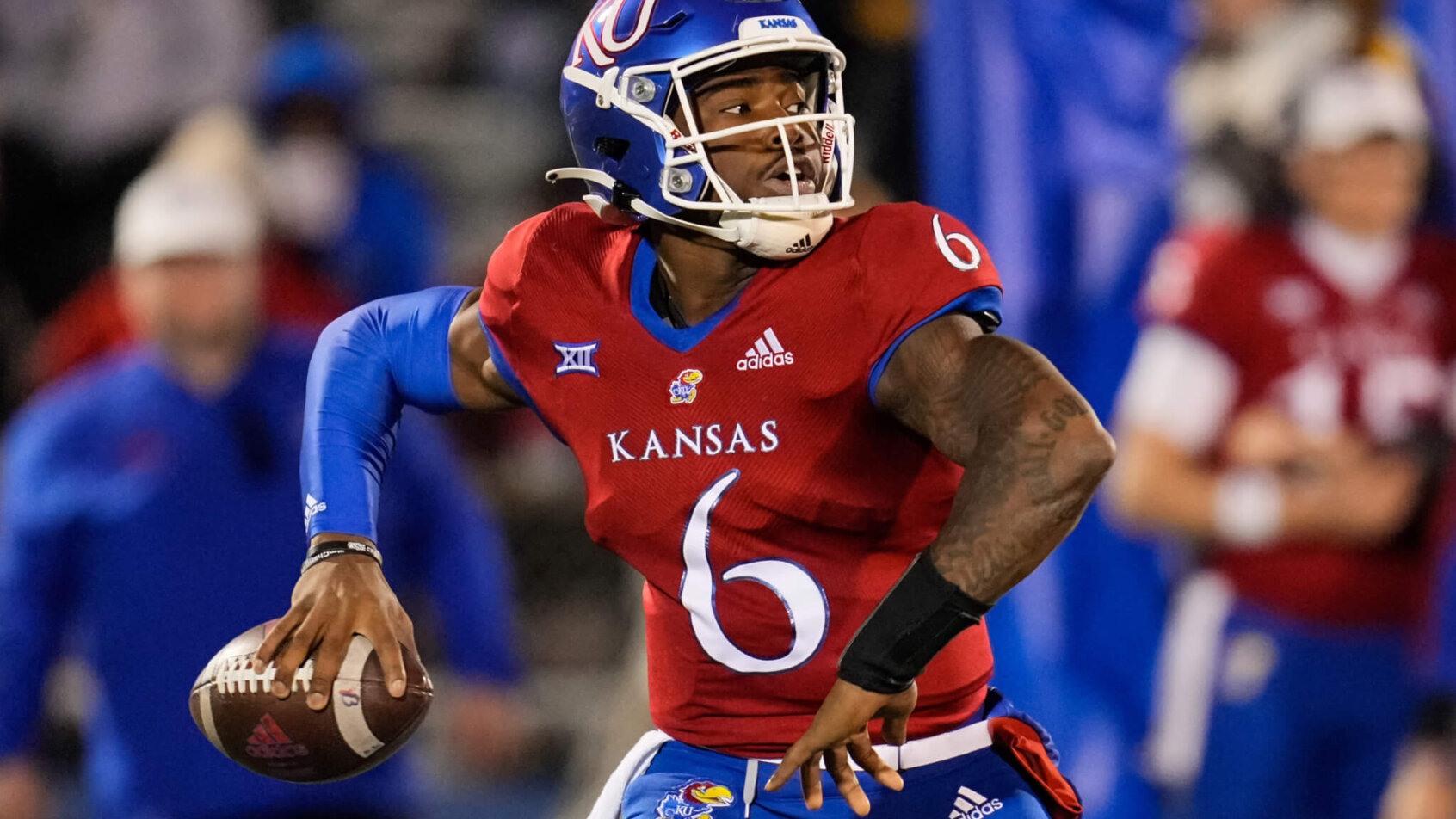 Kansas Jayhawks quarterback Jalon Daniels throwing a pass