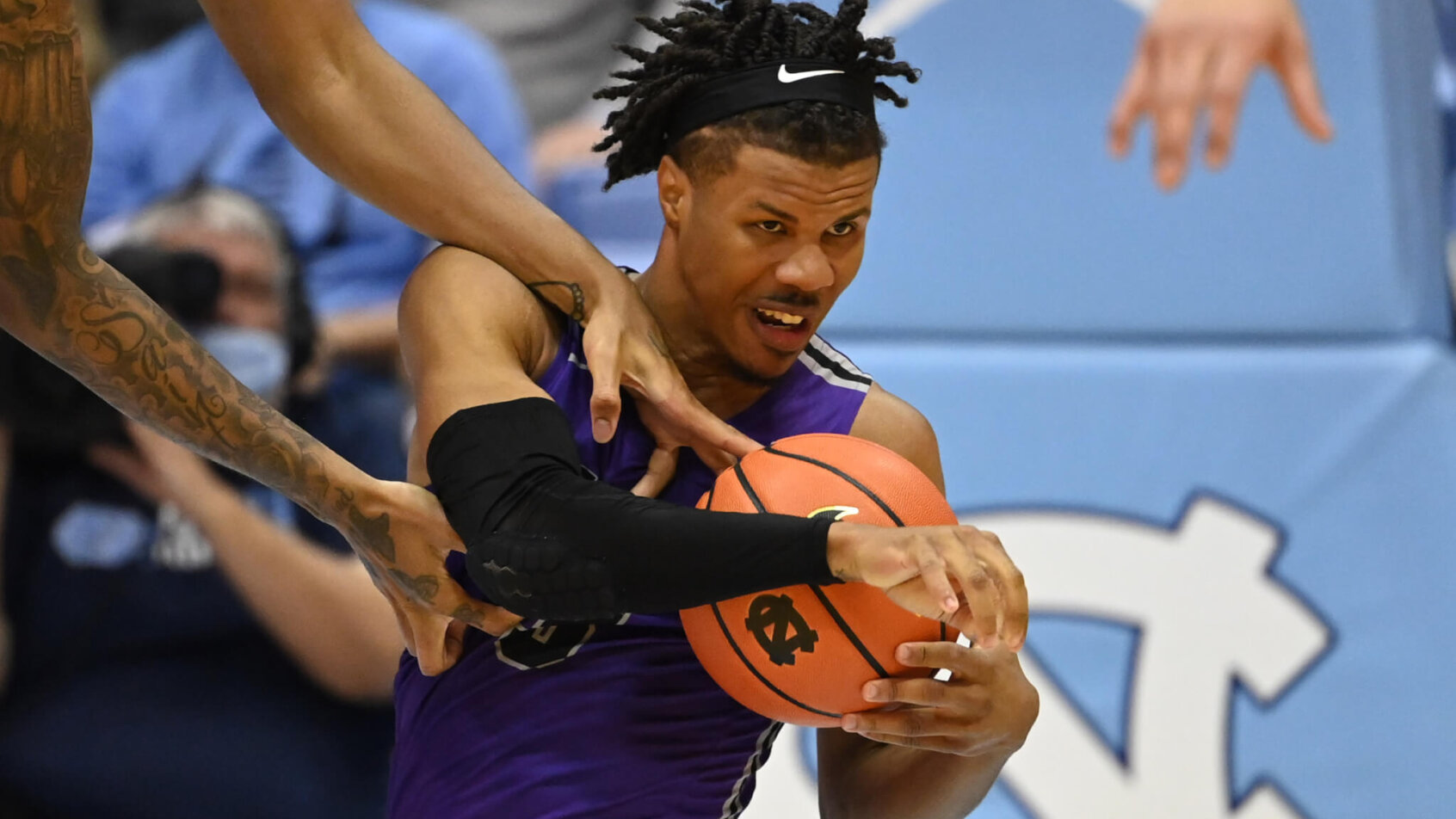 Furman's Mike Bothwell battles for a loose ball