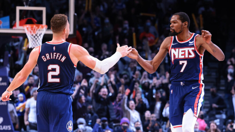 Kevin Durant and Blake Griffin give each other five