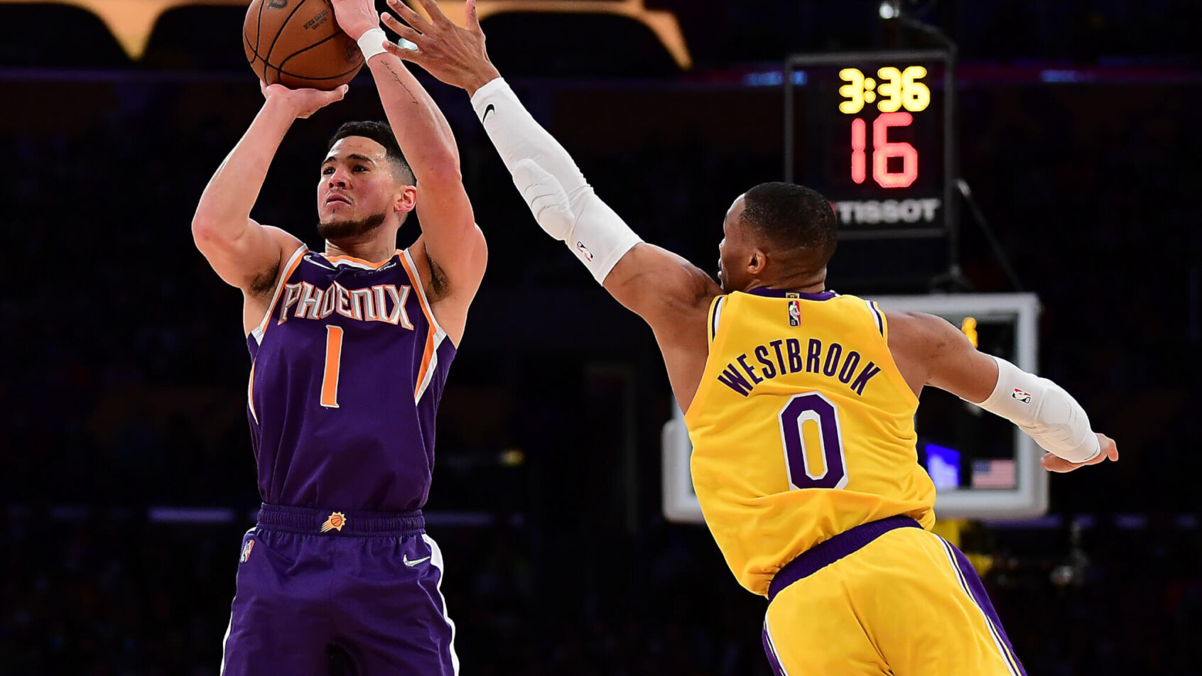 Devin Booker jump shot contested by Russell Westbrook