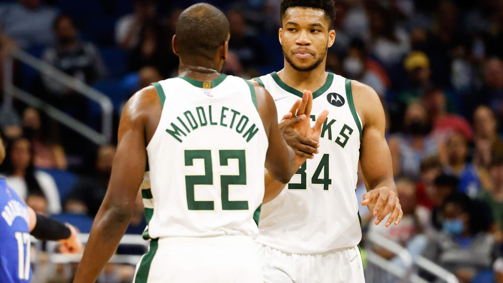 Giannis Antetokounmpo and Khris Middleton give each other five