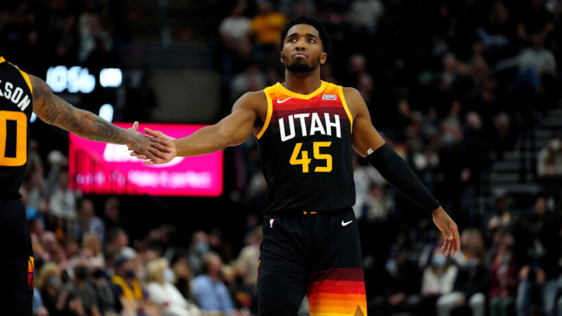 Donovan Mitchell gives five to teammate