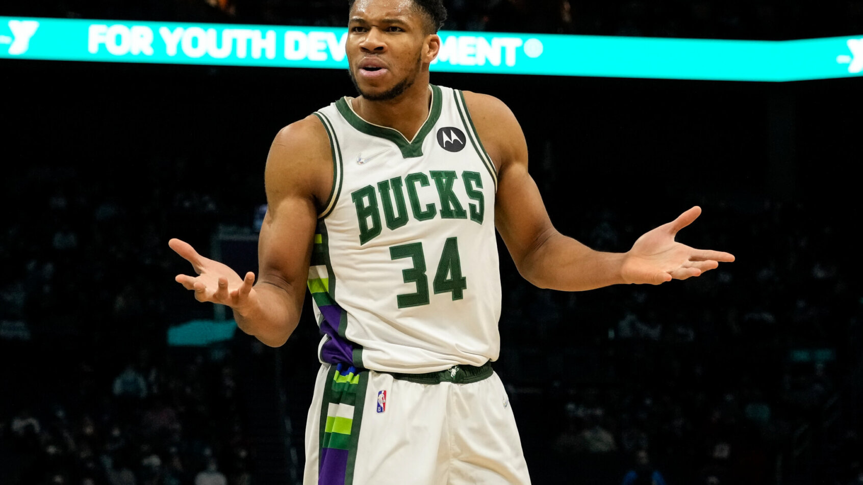 Giannis Antetokounmpo hands out