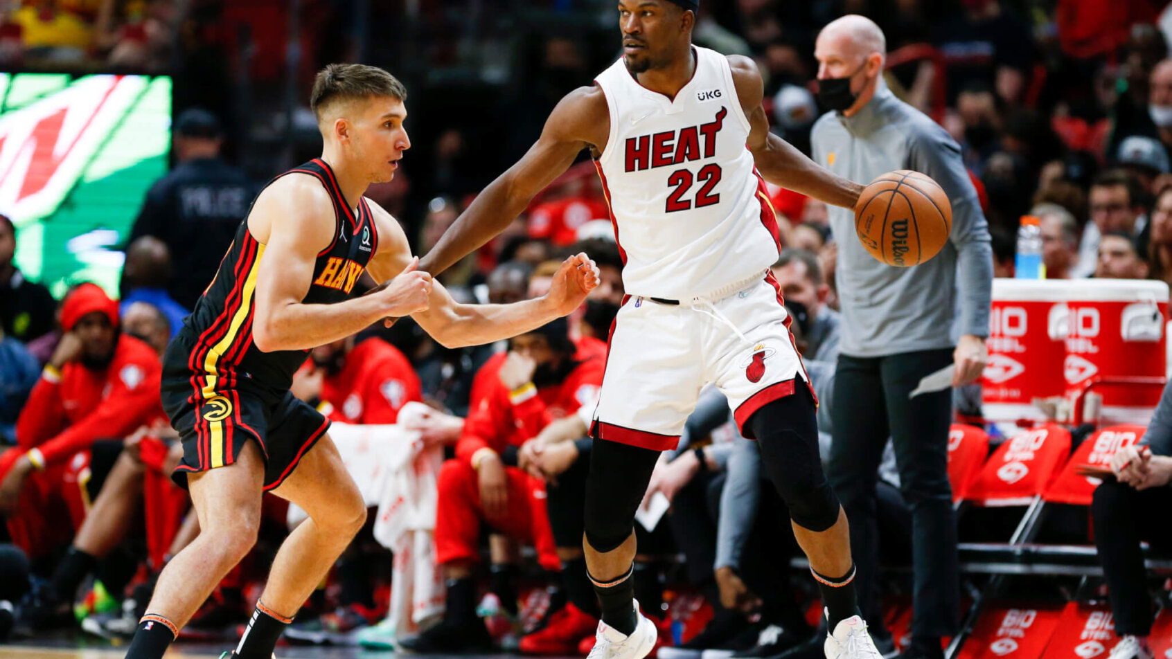 Jimmy Butler holding ball at wing with defender on him