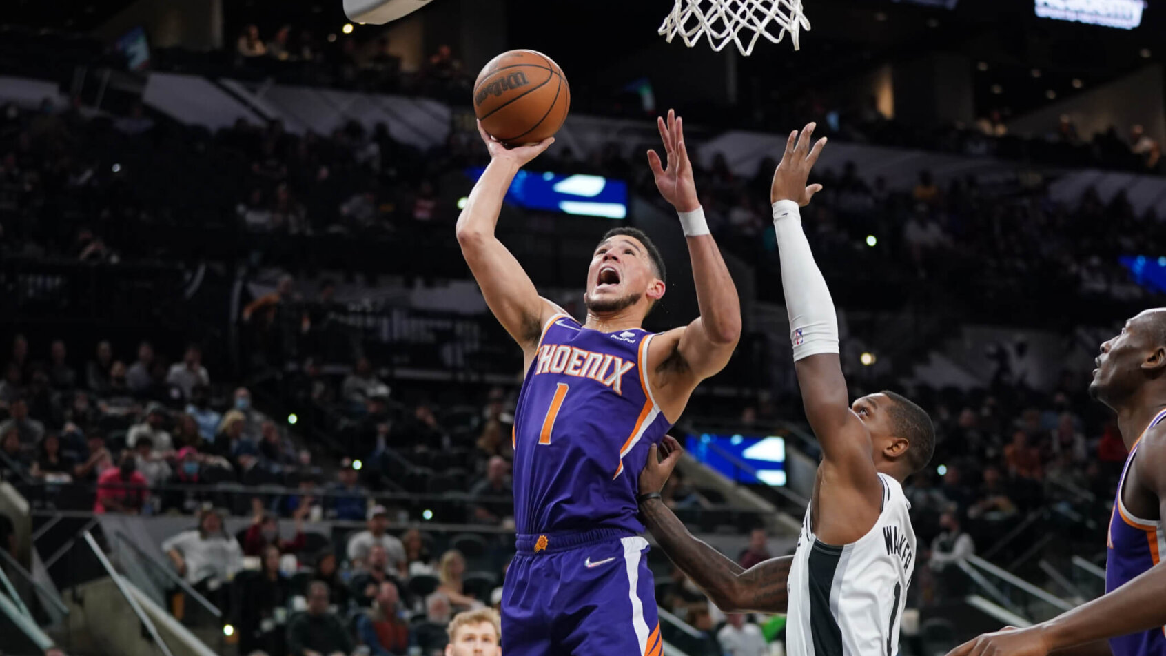 Booker drives to the basket