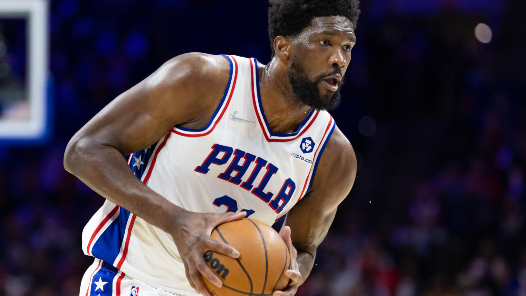 Joel Embiid holding basketball with two hands