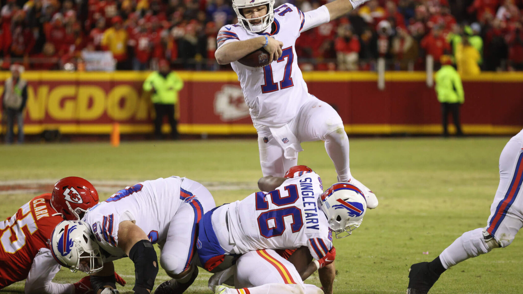 Josh Allen leaps over fallen players