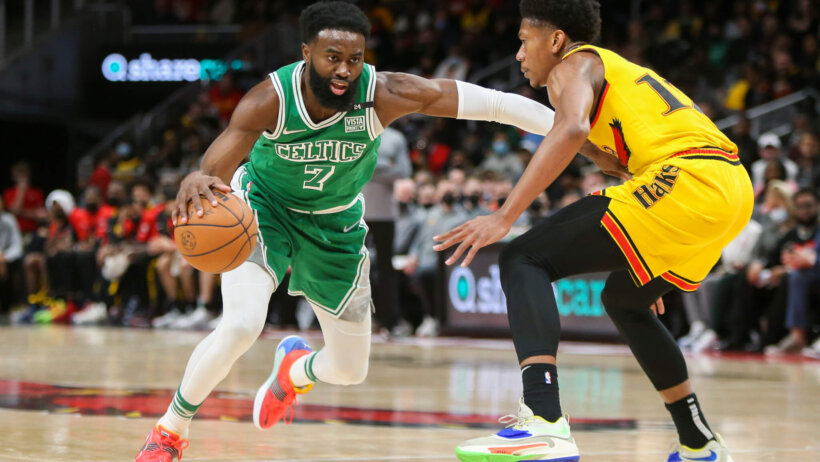 Jaylen Brown, Boston Celtics, drives against De'Andre Hunter, Atlanta Hawks