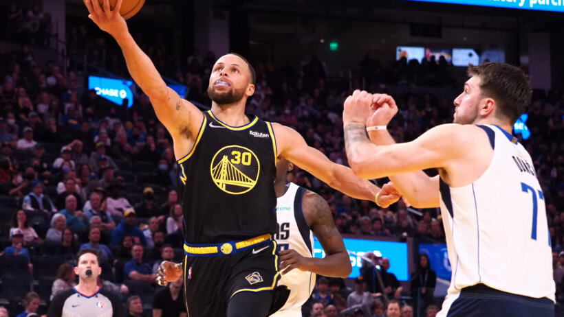 Steph Curry layup in front of Luka Doncic