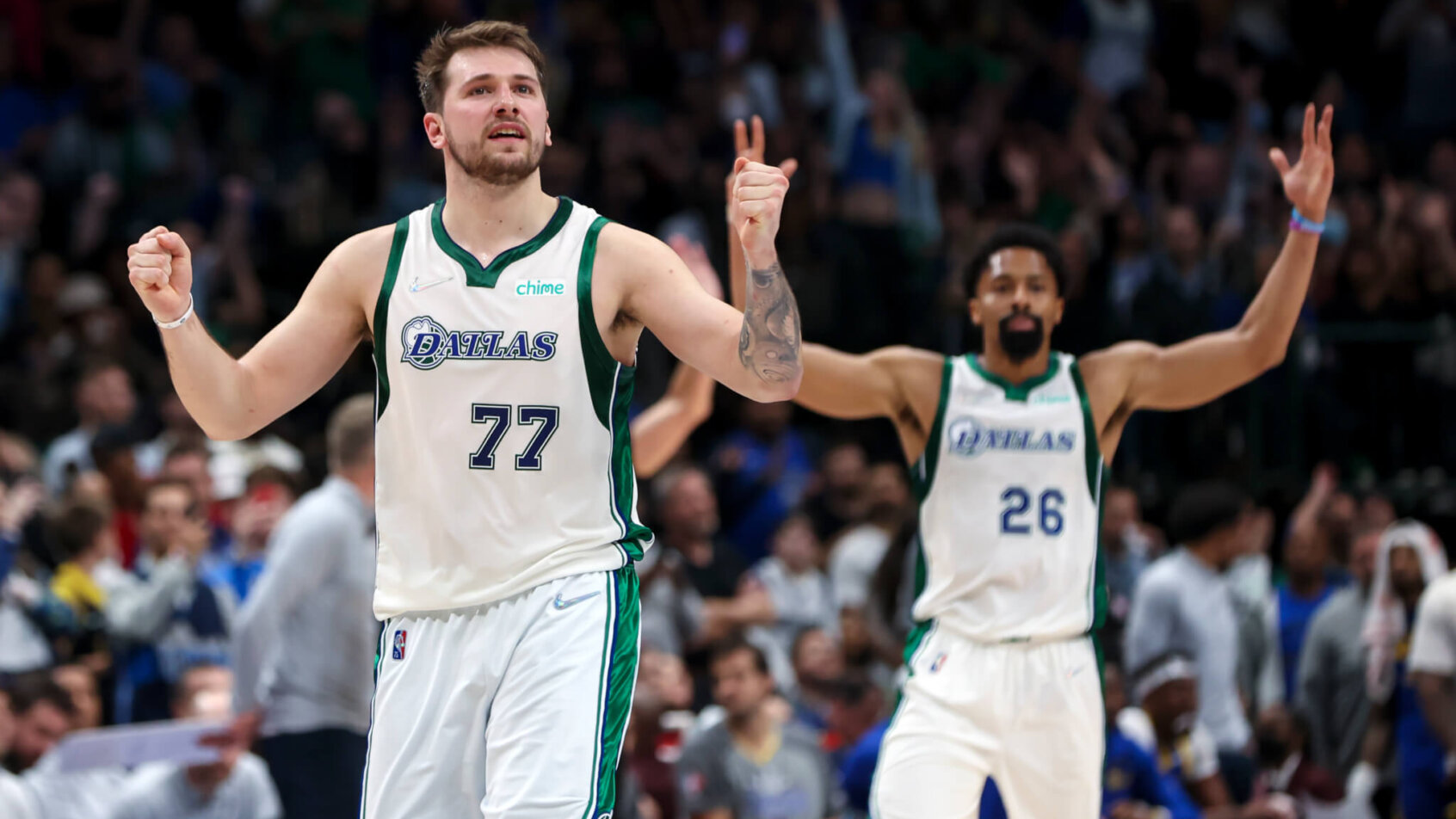 Dallas Mavericks guards Luka Doncic and Spencer Dinwiddie celebrating a basket