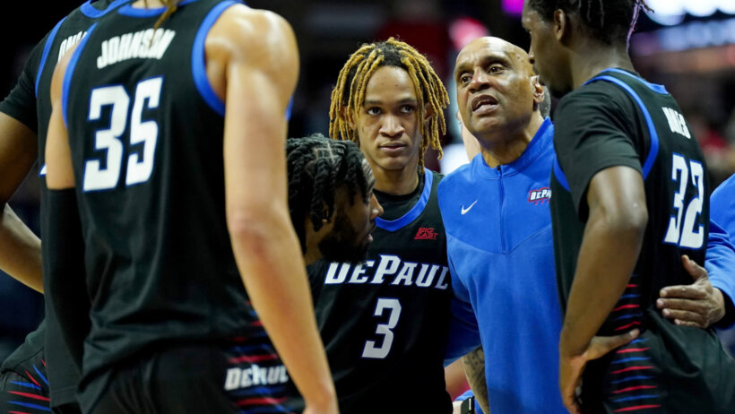 DePaul Blue Demons head coach Tony Stubblefield talks to his t