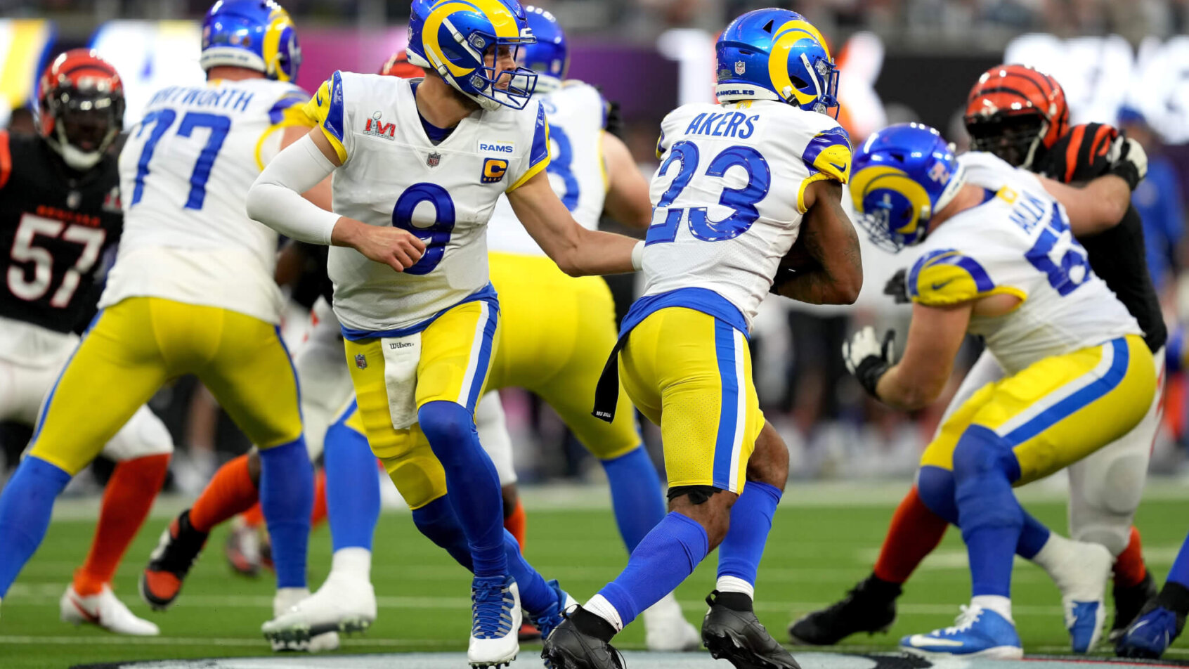 Matthew Stafford hands off to Cam Akers