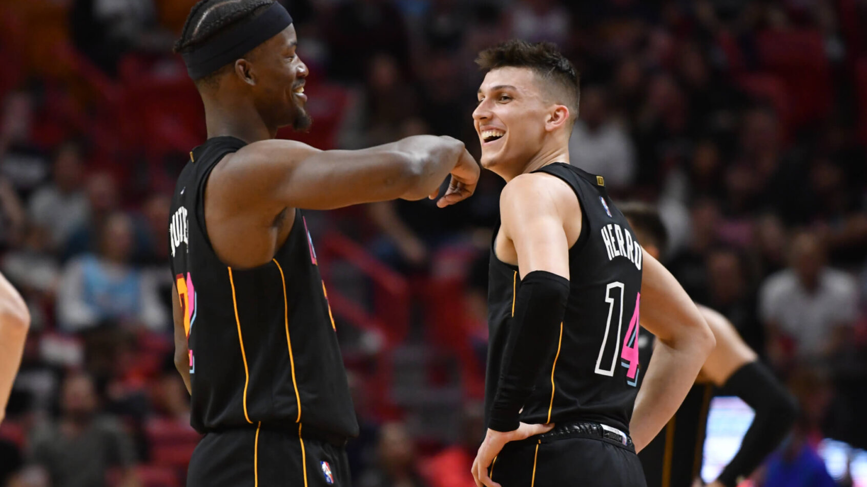 Jimmy Butler and Tyler Herro talking on court