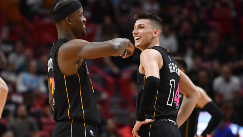 Jimmy Butler and Tyler Herro talking on court