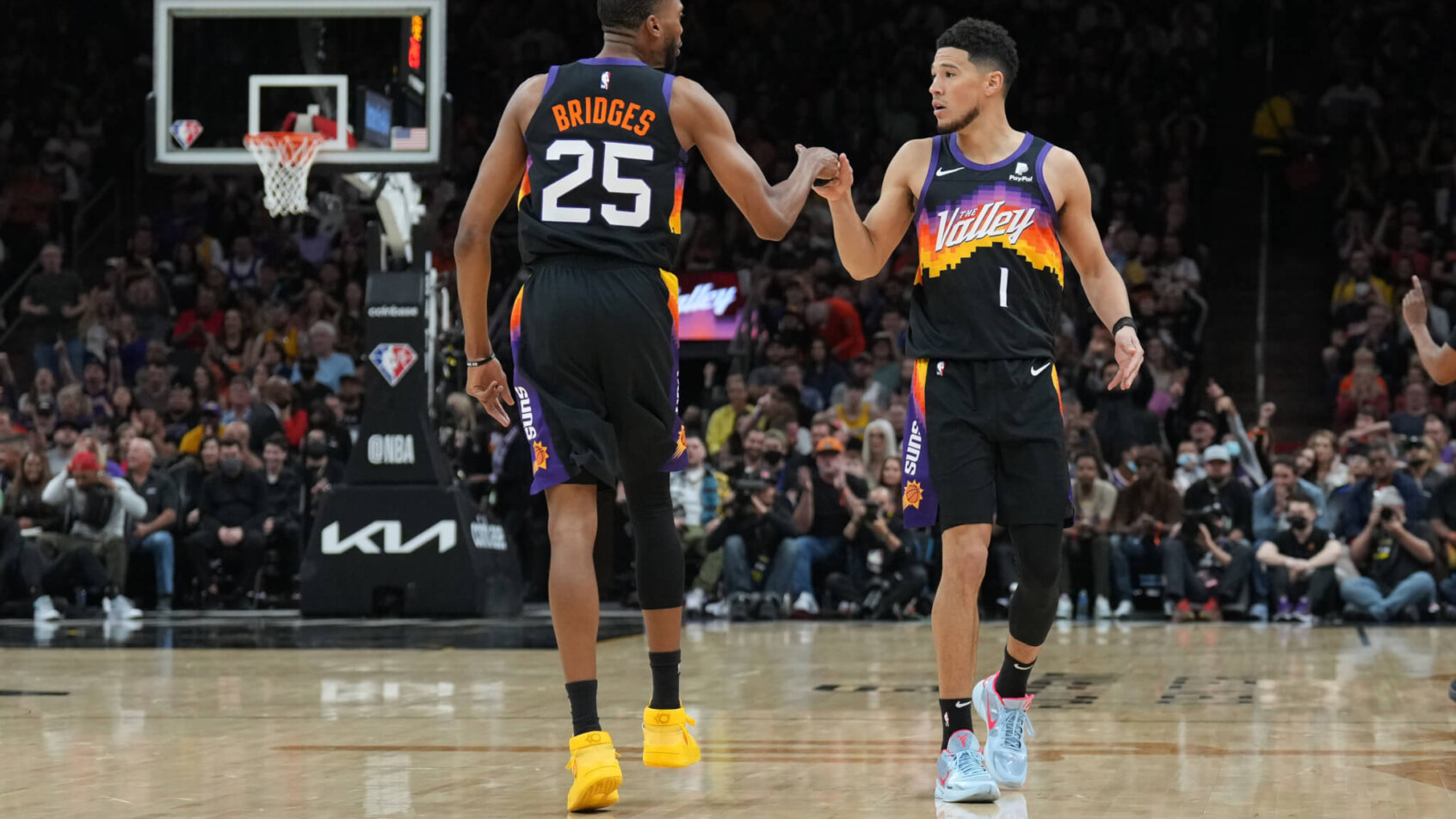 Mikal Bridges and Devin Booker fist bump
