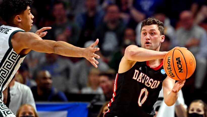 Davidson Wildcats guard Foster Loyer making a pass