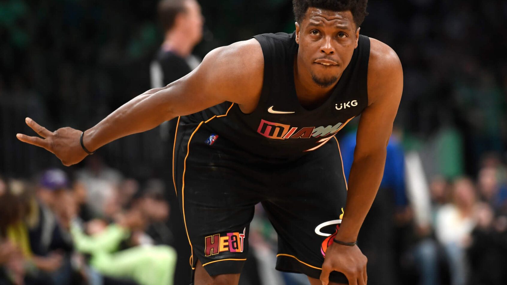 Kyle Lowry hunched over, holding up two fingers