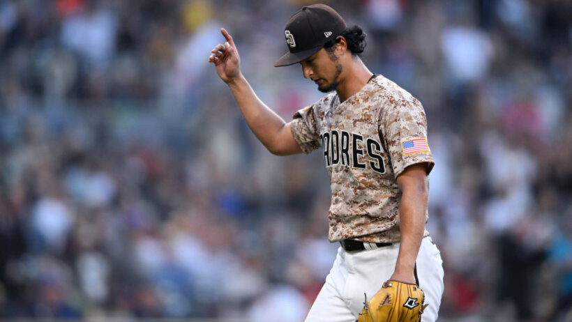 San Diego Padres starting pitcher Yu Darvish waving to the crowd as he exits the field