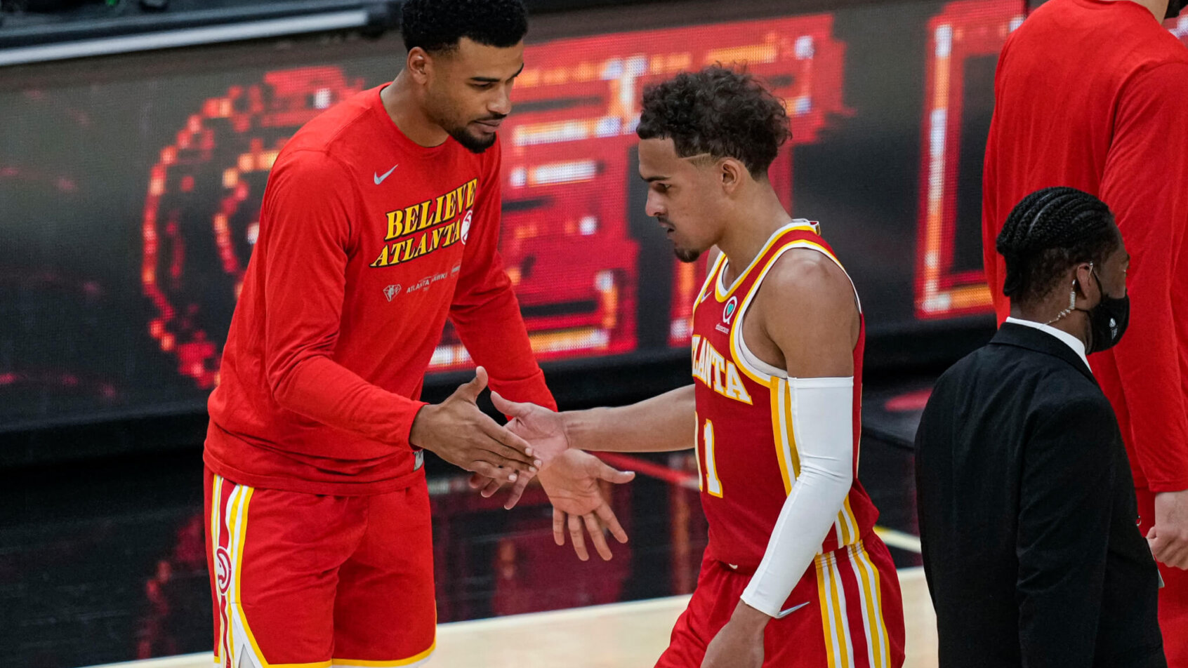 Trae Young high fives teammate