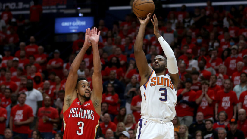 Chris Paul shooting over CJ McCollum during a game.