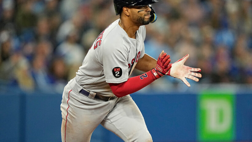 Xander Bogaerts runs after hit; Boston Red Sox