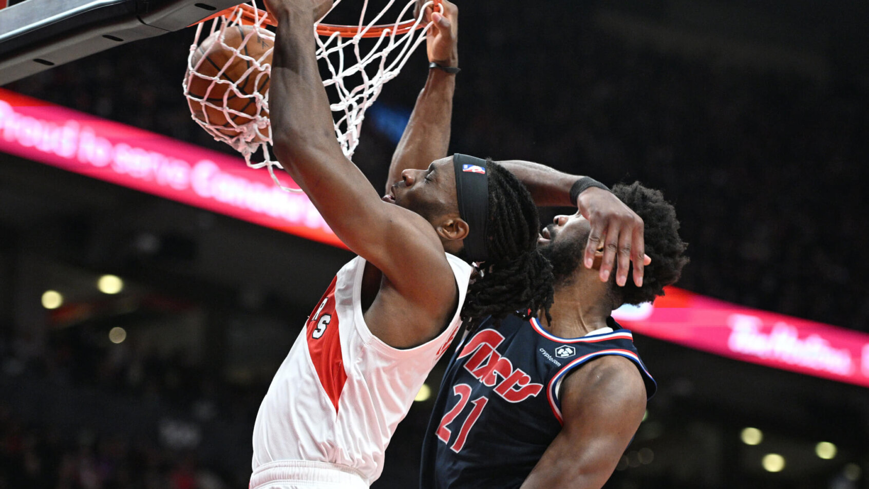 Precious Achiuwa dunks over Joel Embiid