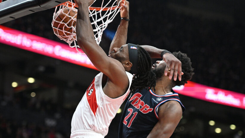 Precious Achiuwa dunks over Joel Embiid