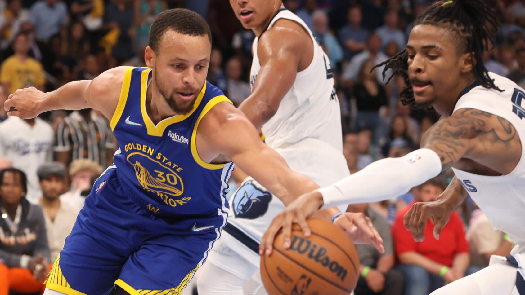 Steph Curry and Ja Morant battle for a loose ball