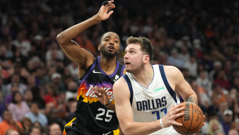 Luka Doncic driving against defender