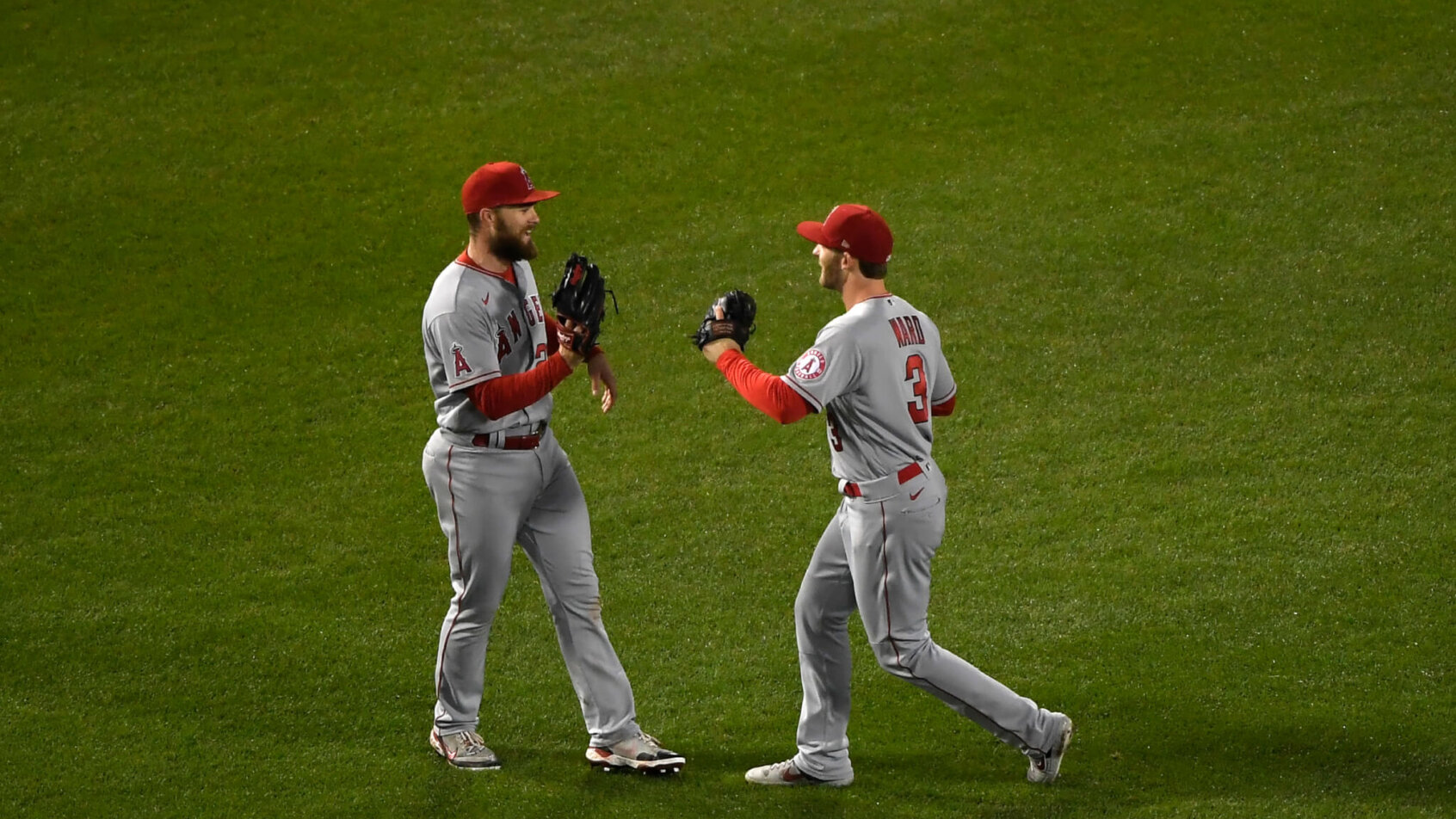 Los Angeles Angels first baseman Jared Walsh celebrates with right fielder Taylor Ward