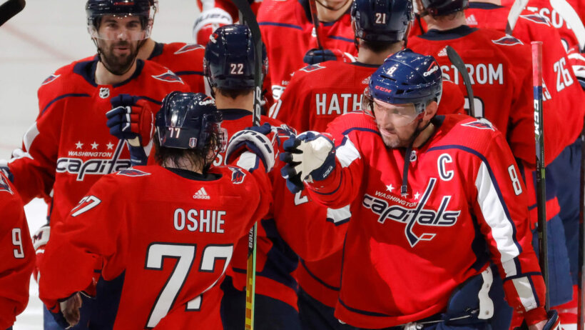 Washington Capitals players celebrating a playoff win over the Florida Panthers