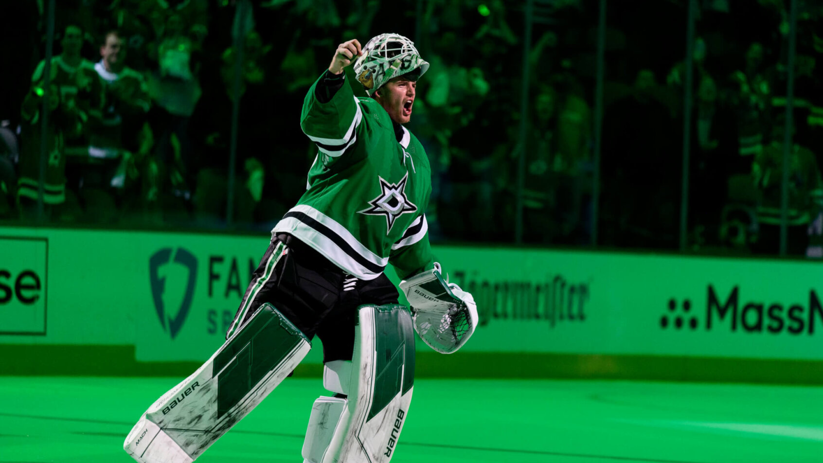 Dallas Stars goaltender Jake Oettinger saluting the crowd after a win