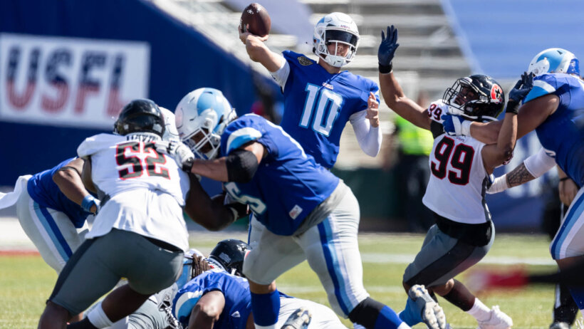 Kyle Slotter throws a pass under pressure
